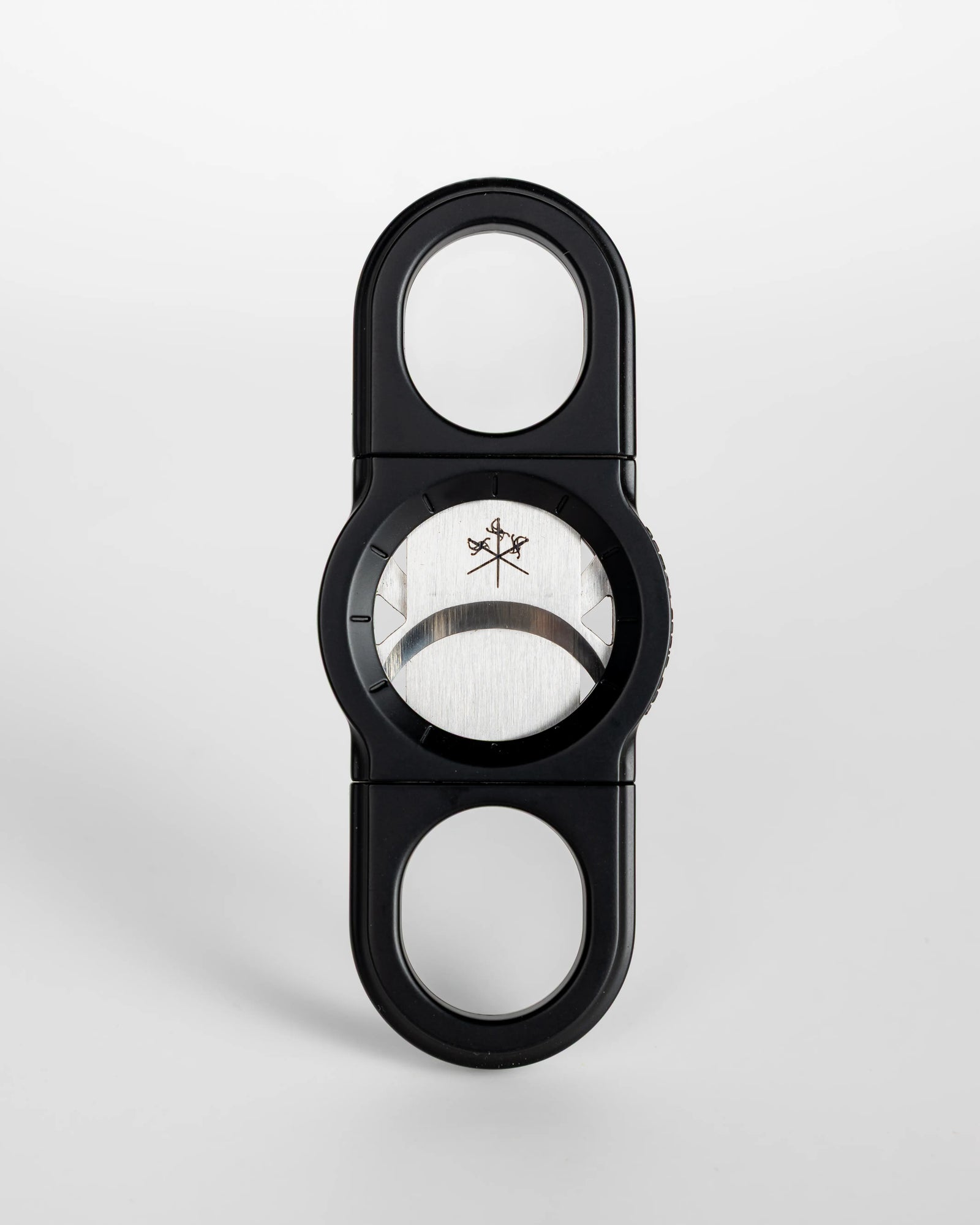 La Guillotine Rotor by LES FINES LAMES, a black stainless steel guillotine cigar cutter shown from the front