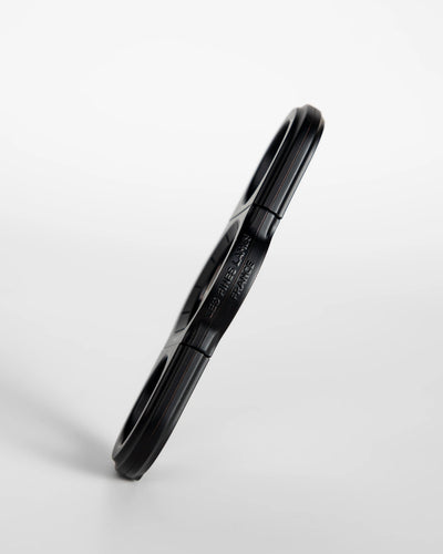 La Guillotine Rotor by LES FINES LAMES, a black stainless steel guillotine cigar cutter shown from the side