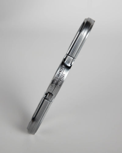 La Guillotine Rotor by LES FINES LAMES, a chrome stainless steel guillotine cigar cutter shown from the side