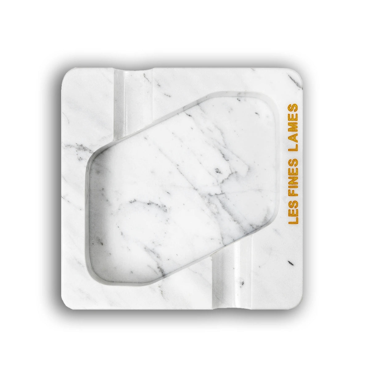 A square white marble-patterned cigarette case with a central cutout, featuring the text 'LES FINES LAMES' printed  on the right side, set against a plain white background.